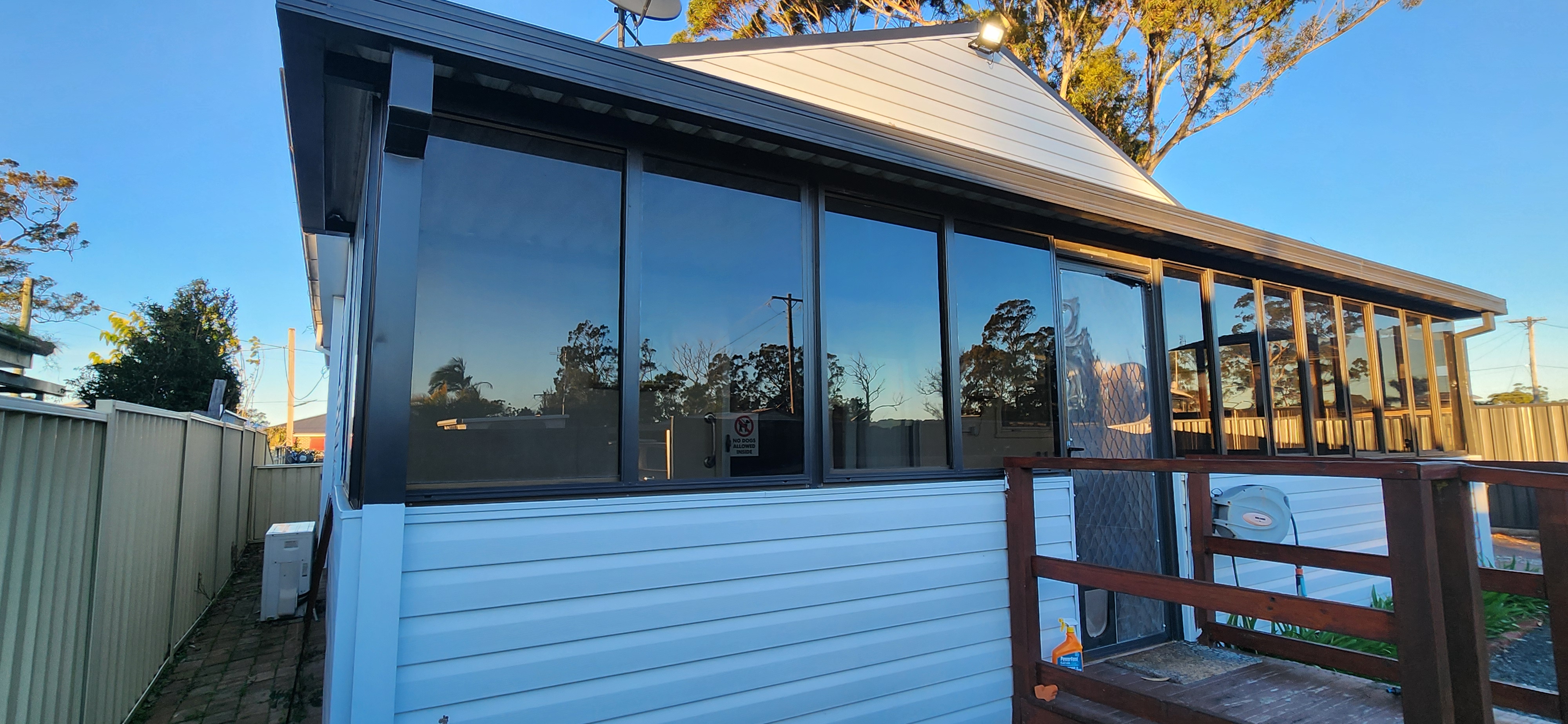 home airbnb rental with sunroom patio area windows tinted to reduce heat and glare whilst still maintaining natural light